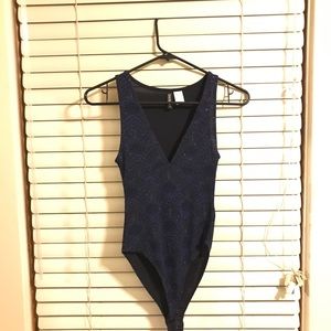 Blue sparkly body suit